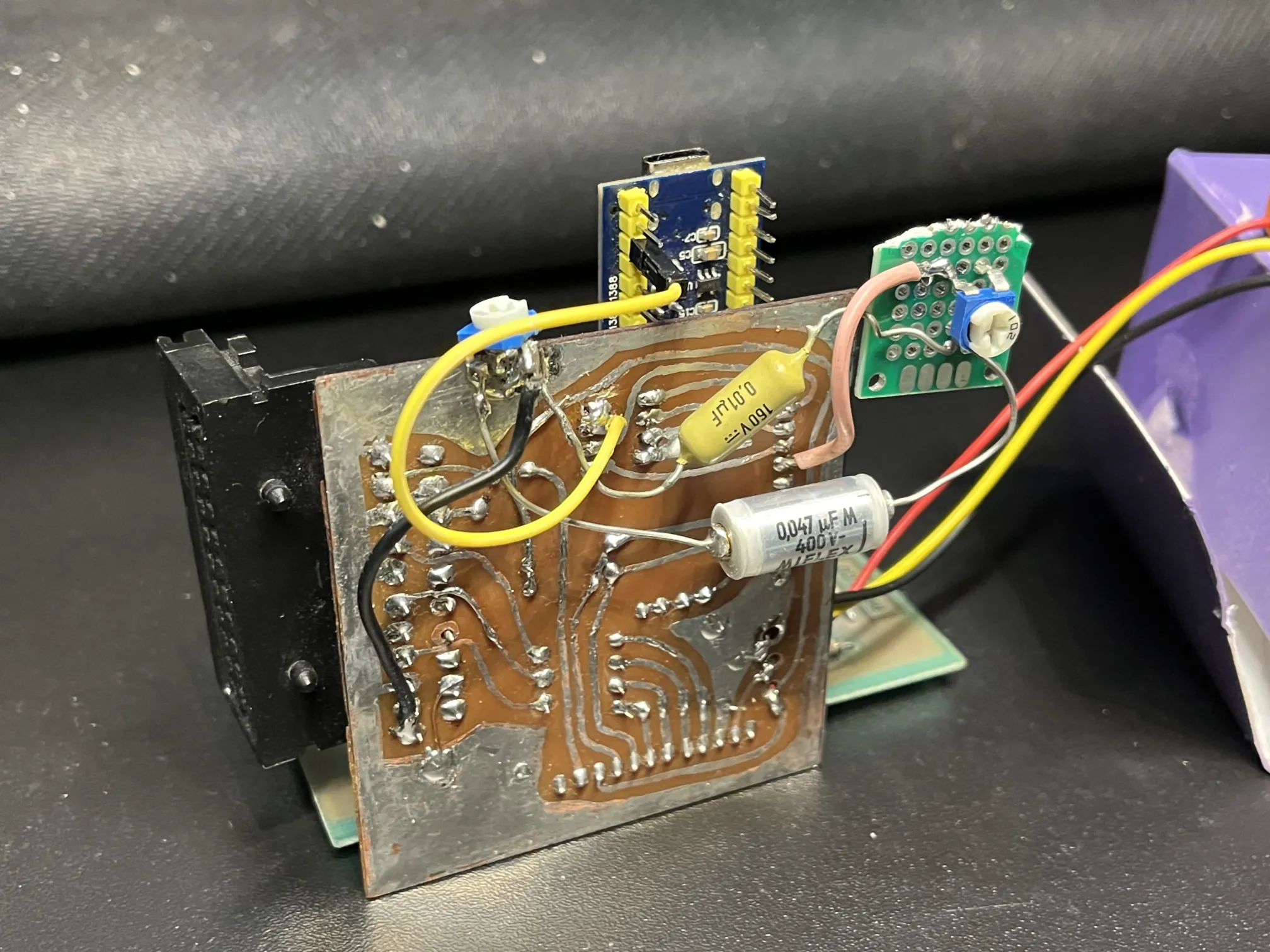 components soldered mid-air to a circuit board